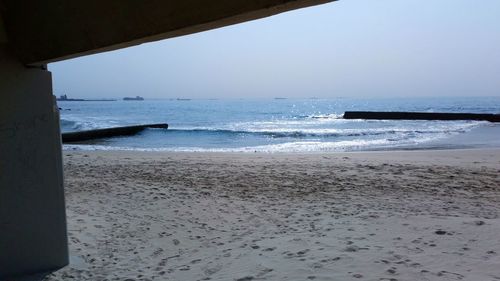 Scenic view of beach against clear sky