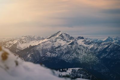 Scenic view of snowcapped mountains against sky during winter