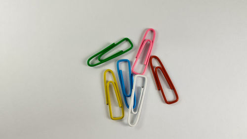 Close-up of colored pencils over white background