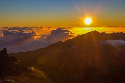 Scenic view of mountains against sky during sunset