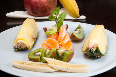 High angle view of fruits in plate on table