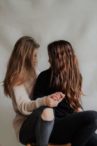 Two young girls holding hands