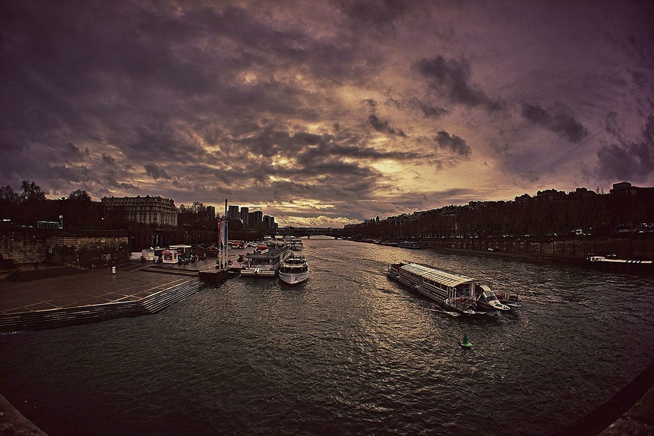 sky, transportation, cloud - sky, water, building exterior, mode of transport, built structure, nautical vessel, architecture, cloudy, moored, dusk, river, weather, the way forward, cloud, boat, high angle view, sunset, outdoors