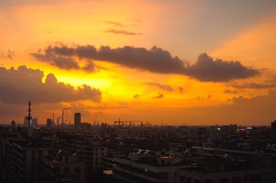 Cityscape against sky during sunset