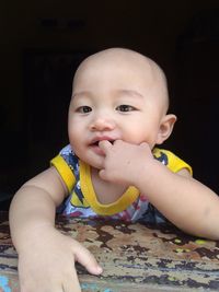 Close-up of cute baby boy at home