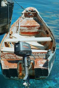 Close-up of fishing boat moored in sea