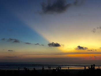 Scenic view of beach against sky during sunset