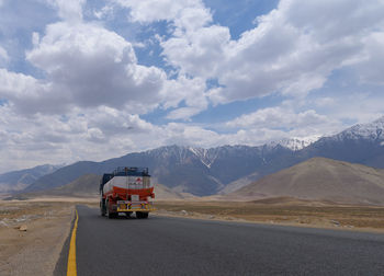 Cars on road against sky