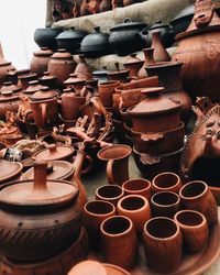 View of objects in row for sale at market