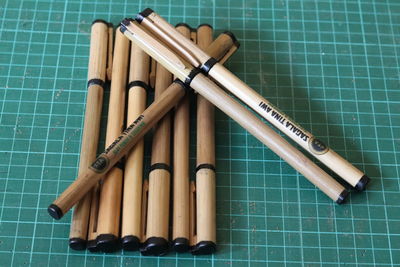 High angle view of pencils against blue background