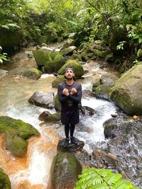 Full length of man standing on rock