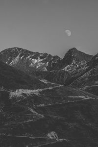 Aerial view of snowcapped mountains against sky