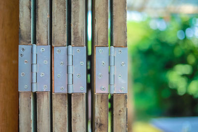 Close-up of wooden fence against blue sky