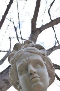 Low angle view of statue against sky