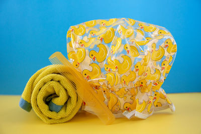 Close-up of stack on table against blue background