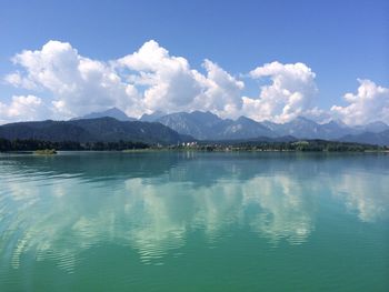 Scenic view of lake against cloudy sky