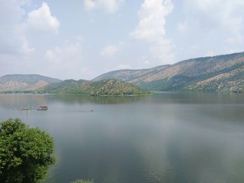 Scenic view of lake with mountains in background