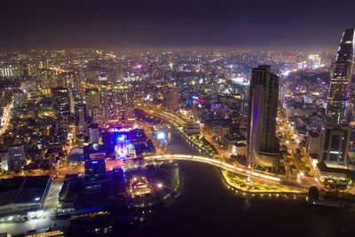 High angle view of illuminated city buildings at night