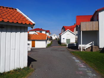 Street amidst buildings against sky