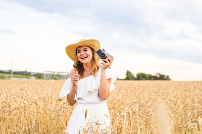 Young woman standing in field