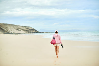 Full length of man standing on beach