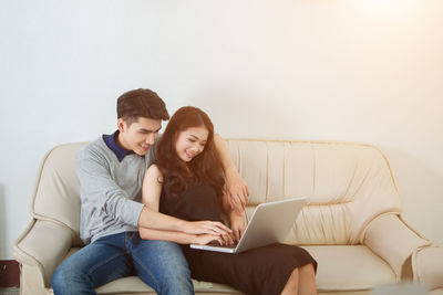 Couple on sofa at home