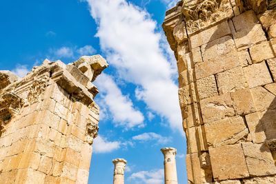 Low angle view of old ruins against sky