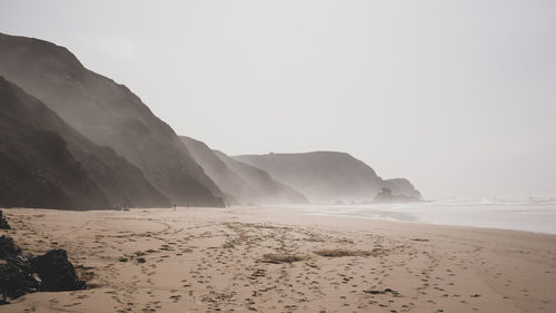 Scenic view of beach against clear sky