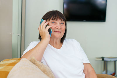 Modern communications. smiling caucasian elderly woman in casual clothes