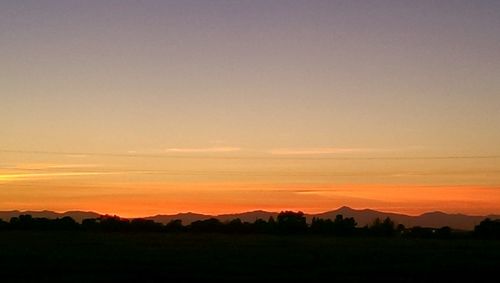 Scenic view of mountains at sunset