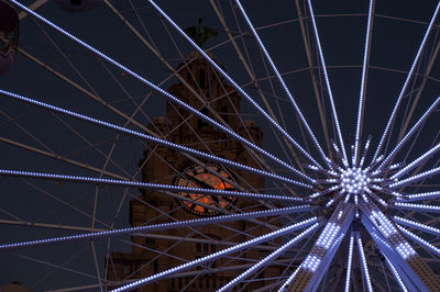 Low angle view of illuminated panoramic wheel at night