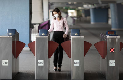 Full length of woman using mobile phone