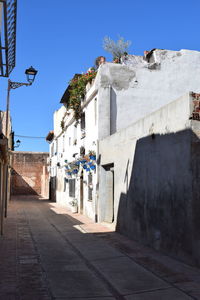 Alley amidst buildings in city