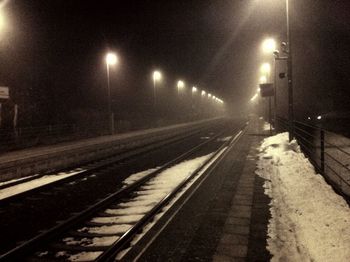 Railroad tracks at night