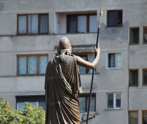 Low angle view of statue against building