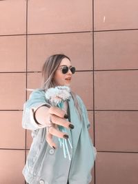 Portrait of young woman in sunglasses