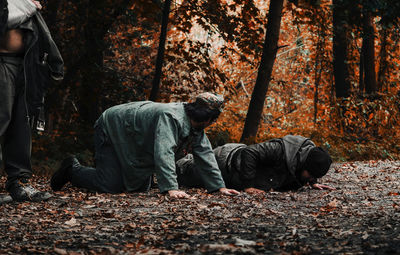 Men sitting in park during autumn