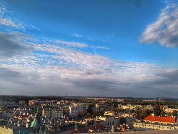 High angle view of houses in town against sky