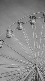 Low angle view of ferris wheel against sky