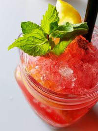 Close-up of strawberry smoothie in mason jar on table