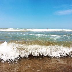 Scenic view of sea against clear blue sky