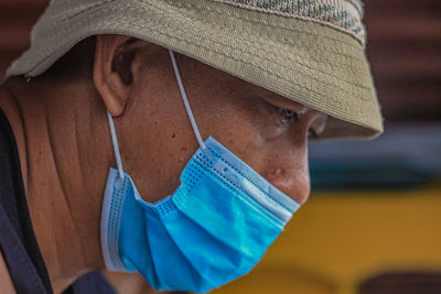 Woman wearing stylish protective face mask.accessory during quarantine of coronavirus pandemic.