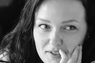 Close-up portrait of a smiling young woman