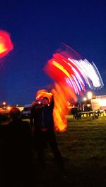 Blurred motion of people at night