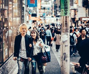 People walking on street in city