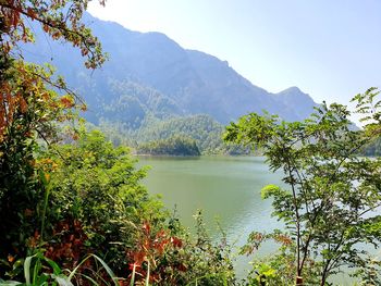Scenic view of lake and mountains against sky