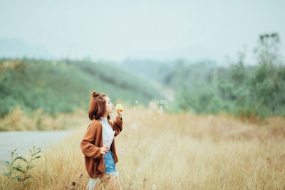 Woman standing on field