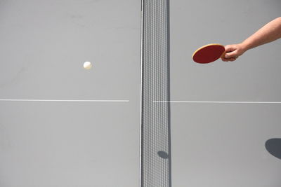 Cropped image of man playing ping pong