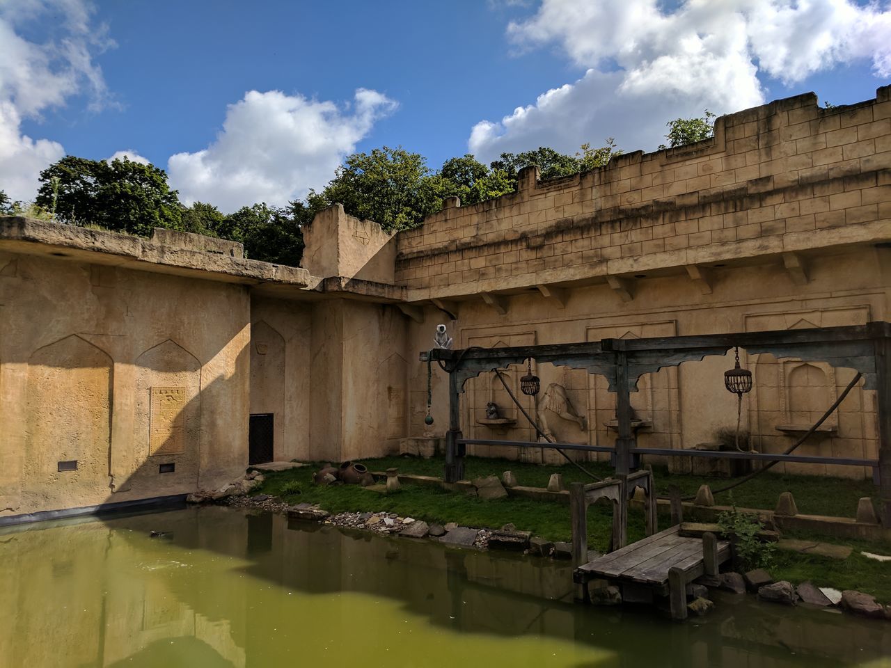 architecture, sky, built structure, water, cloud - sky, connection, day, outdoors, no people, tree, nature, building exterior