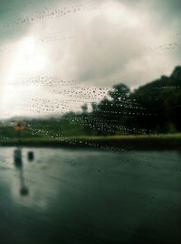 Raindrops on glass window during rainy season